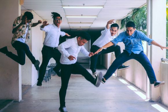 Employees - group of people doing jump shot photography