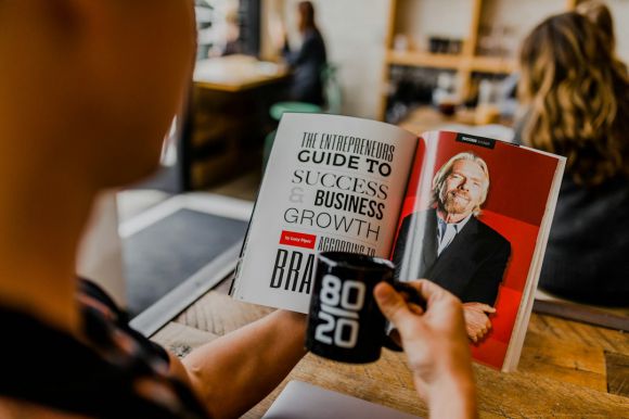 Startup Business - man reading magazine