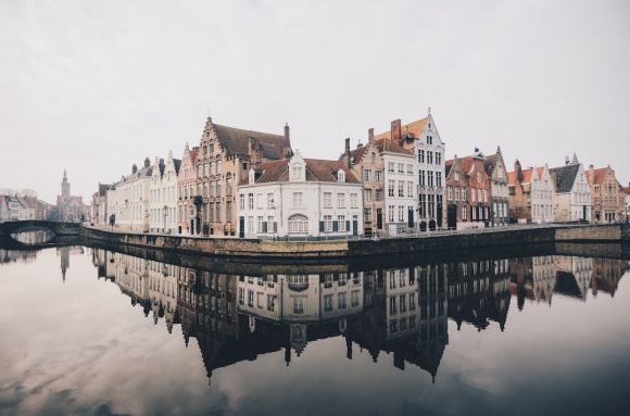 Belgium - white and brown concrete buildings near bodies of water